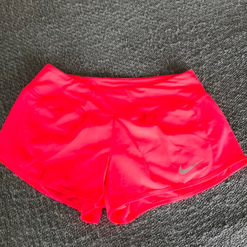 Pink Nike running shorts